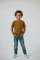 Boy in #AD7F07 t-shirt front new pose